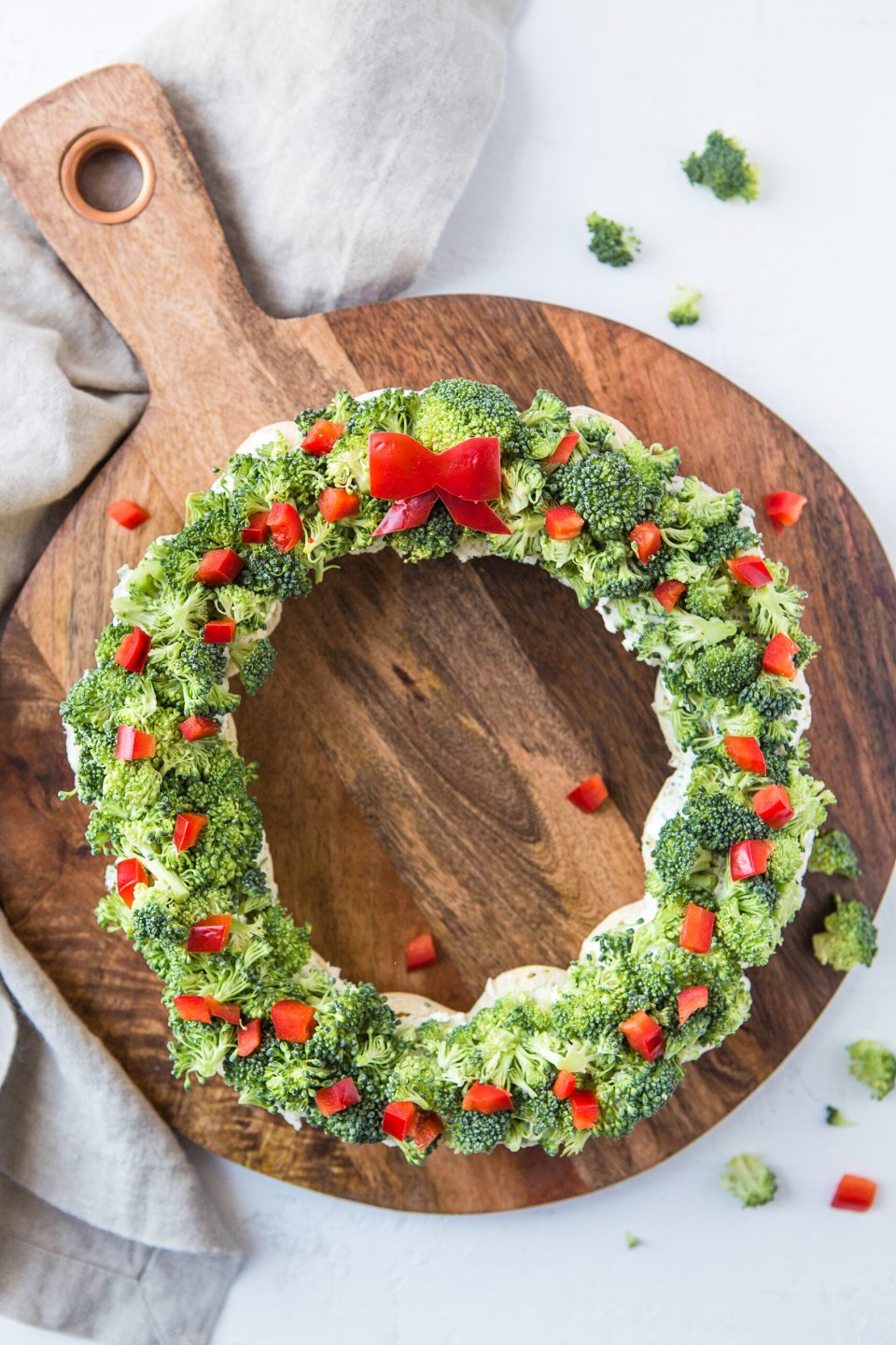 Dough balls that are cooked in the shape of a wreath. Then topped with a cream cheese and ranch mixture and sprinkled with chopped broccoli and red pepper.