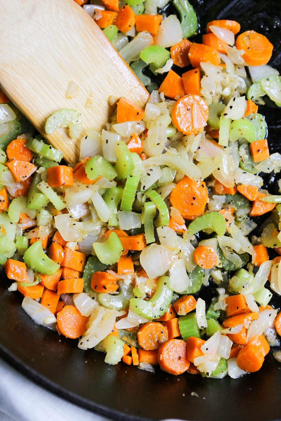 An image of mirepoix which is onions, carrots, and celery sautéed together making the base of a soup or stew. 